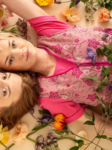 Two women wearing clothes from Gudrun Sjödén’s 2025 High Summer collection.