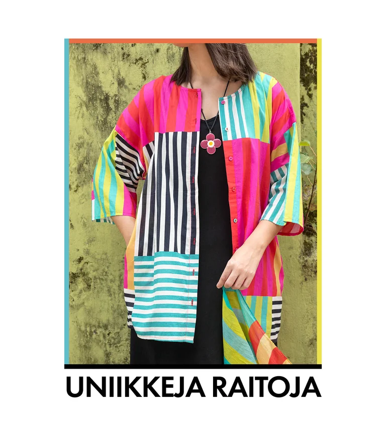 A woman wearing a colorful striped blouse from Gudrun Sjödén.