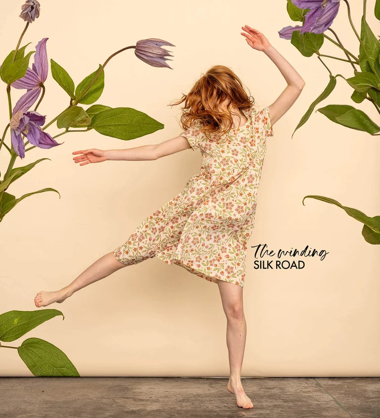 A woman wearing a floral dress from Gudrun Sjödén’s 2025 High Summer collection.