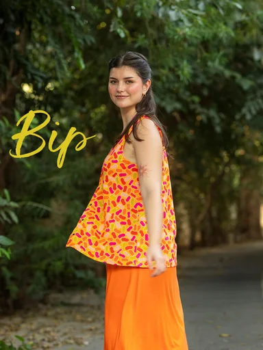 A woman wearing a patterned vest from Gudrun Sjödén.