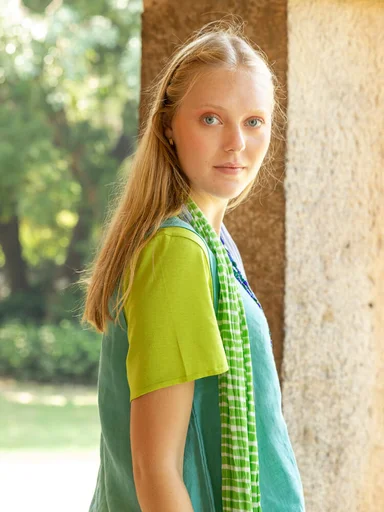 A woman wearing solid-colored clothing from Gudrun Sjödén