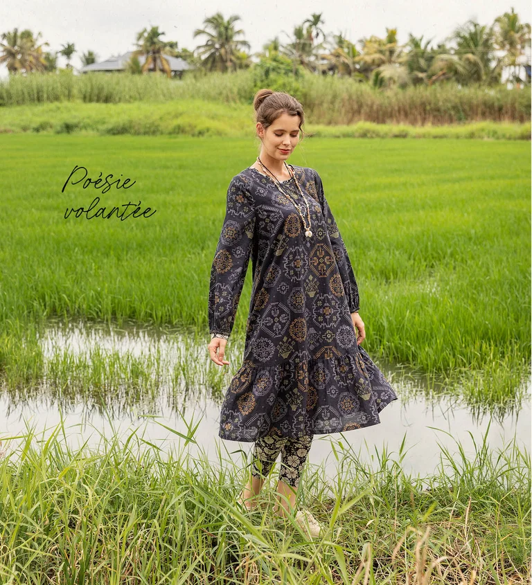A woman wearing a checked dress from Gudrun Sjödén.