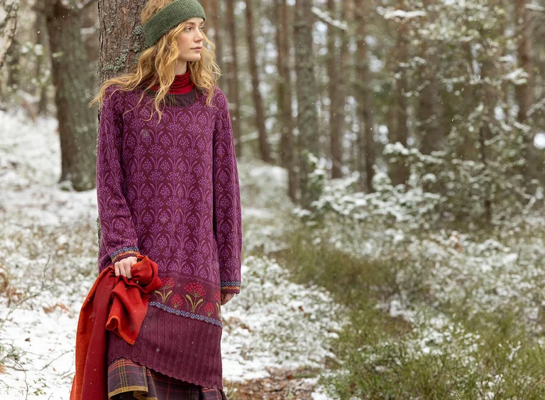 A woman wearing a knit dress from Gudrun Sjödén.