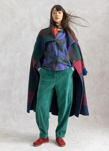 A woman wearing layers of clothing from Gudrun Sjödén’s winter collection.
