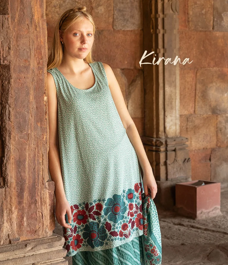 A woman wearing a patterned dress from Gudrun Sjödén.