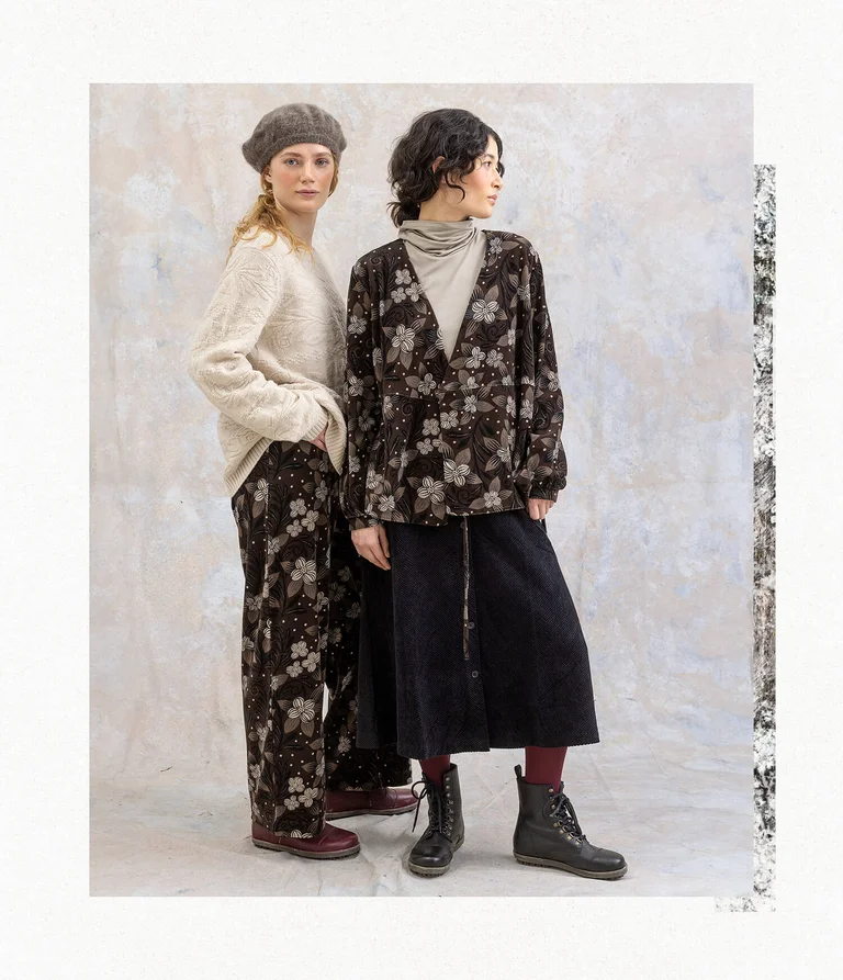Two women wearing layers of clothing from Gudrun Sjödén’s 2025 winter collection.