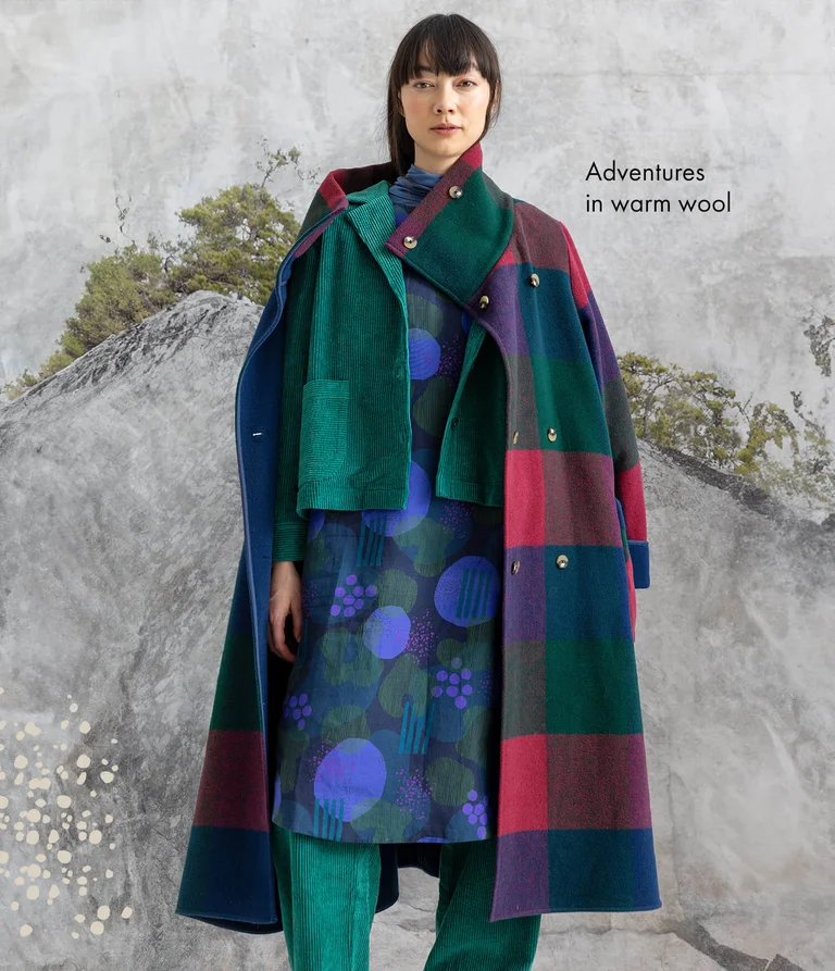 A woman wearing layers of clothing from Gudrun Sjödén’s 2025 winter collection.