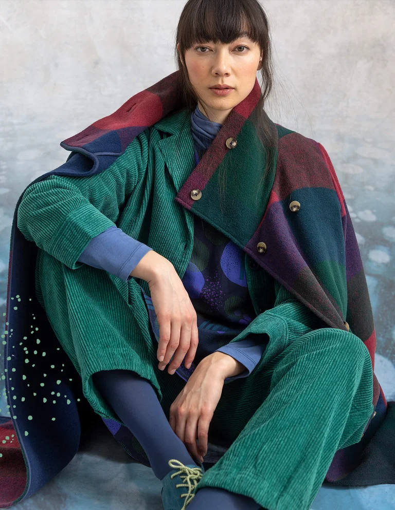 A woman wearing layers of clothing from Gudrun Sjödén’s winter collection.