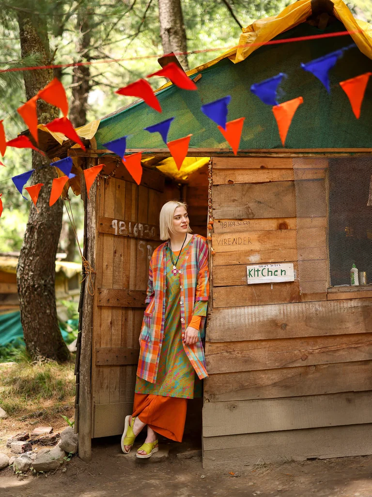 A woman wearing a checked dress from Gudrun Sjödén.