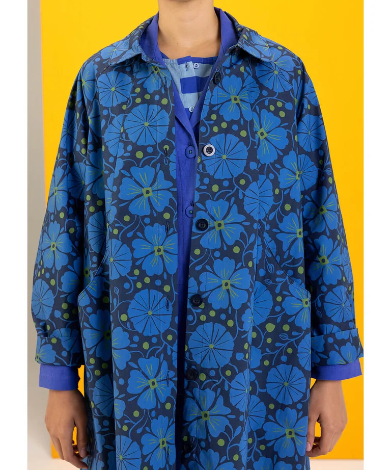 A closeup of the Cress coat in blue from Gudrun Sjödén.