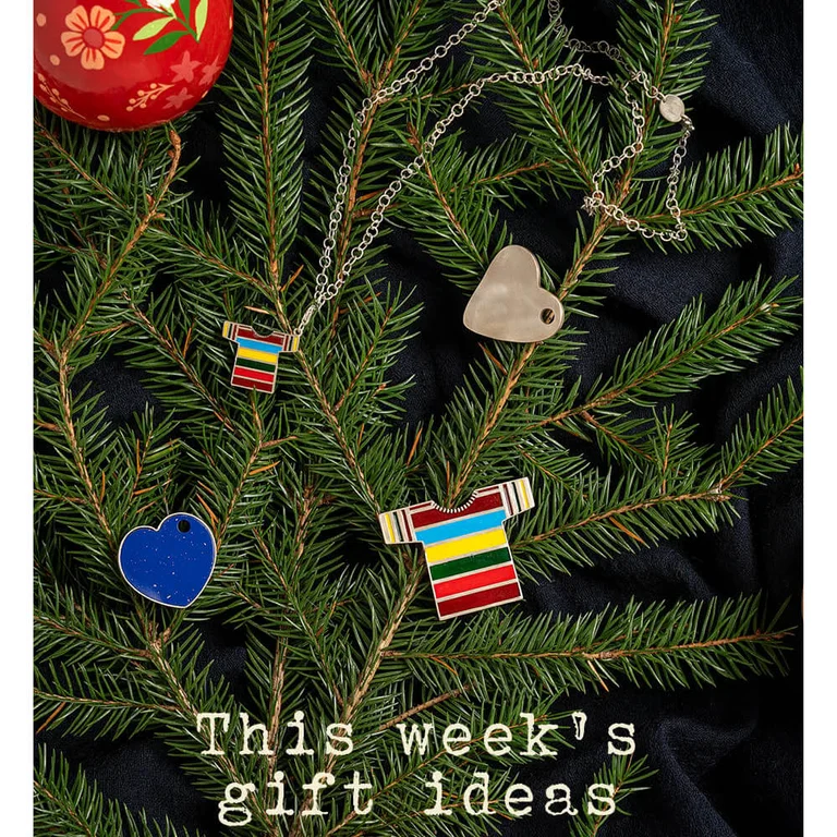 Necklace, charms and a silver brooch from Gudrun Sjödén. All hanging in a Christmas tree.