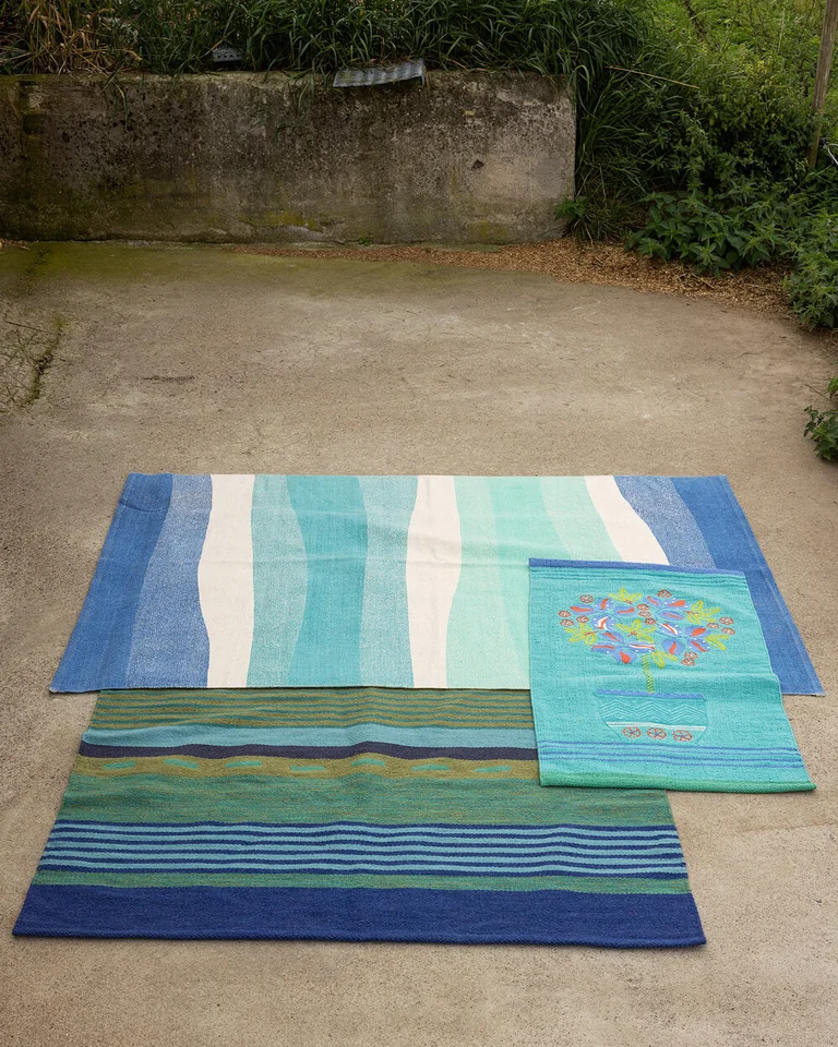 Three blue patterned mats from Gudrun Sjödén.  