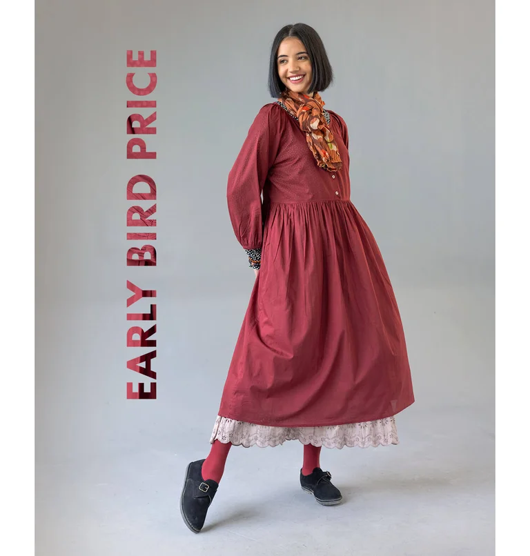A woman posing in a red woven dress from Gudrun Sjödén.