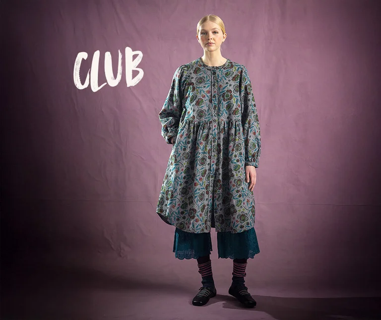 A woman wearing layered clothes from Gudrun Sjödén.