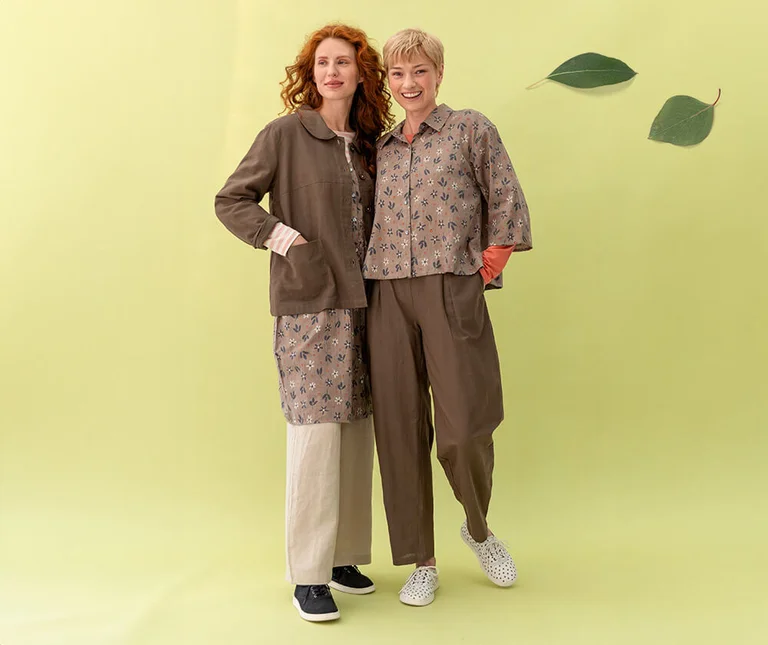 Two women wearing clothing in shades of brown from Gudrun Sjödén.