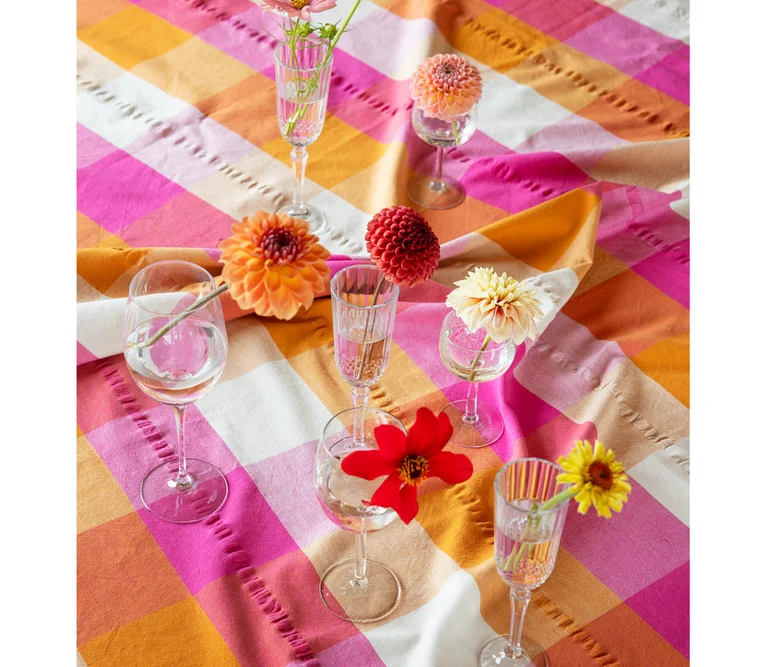 A table laid with home textiles from Gudrun Sjödén.