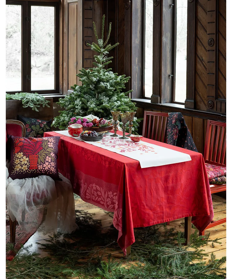 A table with tablecloth and runner from Gudrun Sjödén’s 2024 Christmas collection. 