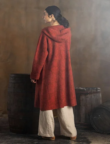 “Wind” knitted coat crafted from felted organic wool - rust