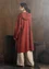 “Wind” knitted coat crafted from felted organic wool (rust S)