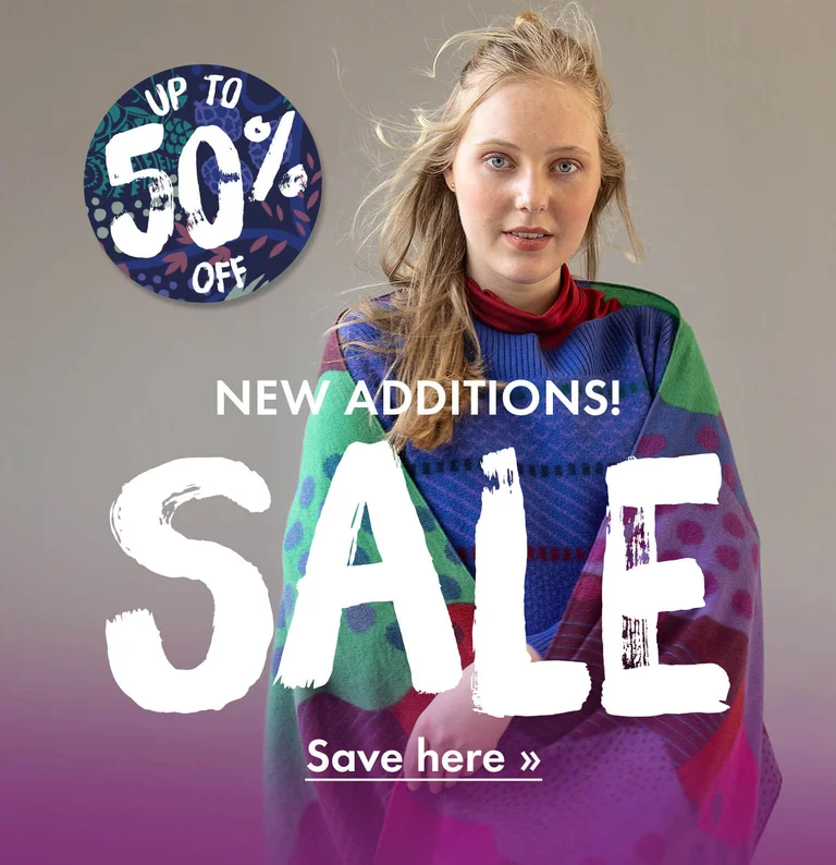 A woman wearing colourful clothes from Gudrun Sjödén.