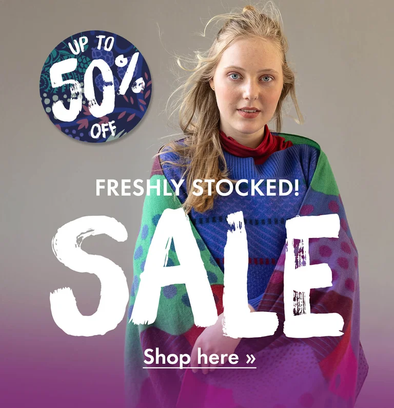 A woman wearing colourful clothes from Gudrun Sjödén.