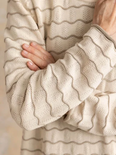 A woman wearing knitted clothes from Gudrun Sjödén.