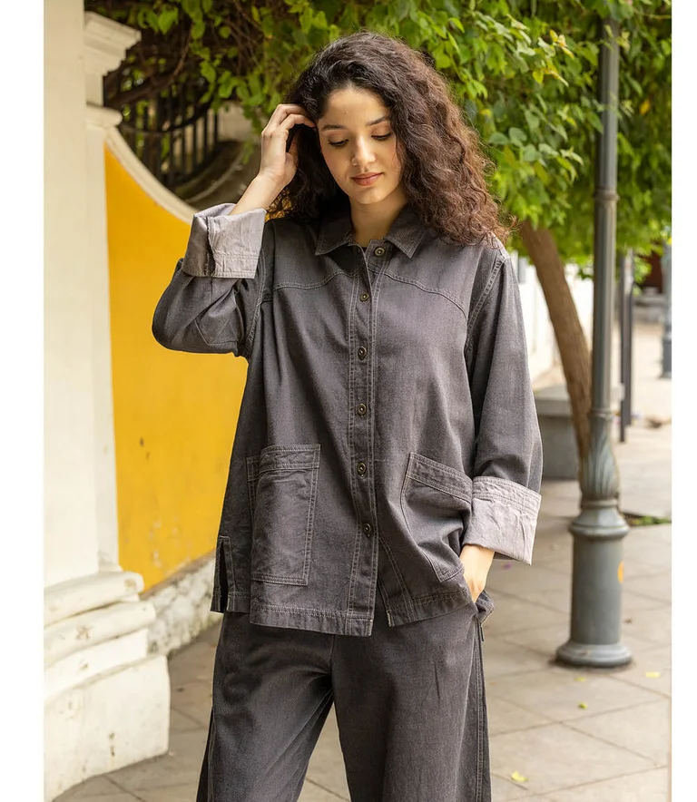 A woman wearing denim-inspired clothes from Gudrun Sjödén.