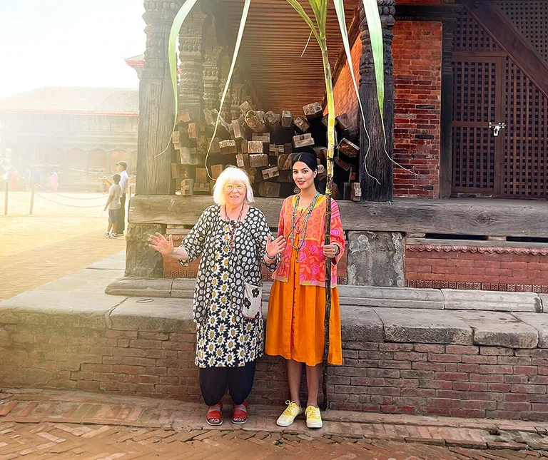 Two women wearing patterned styles from Gudrun Sjödén.