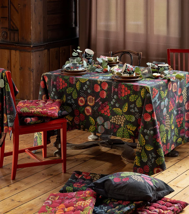 A room with patterned home textiles from Gudrun Sjödén.