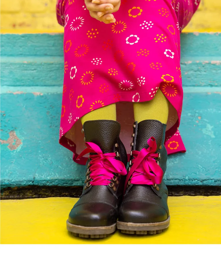 A pair of boots with pink silk ribbons from Gudrun Sjödén.